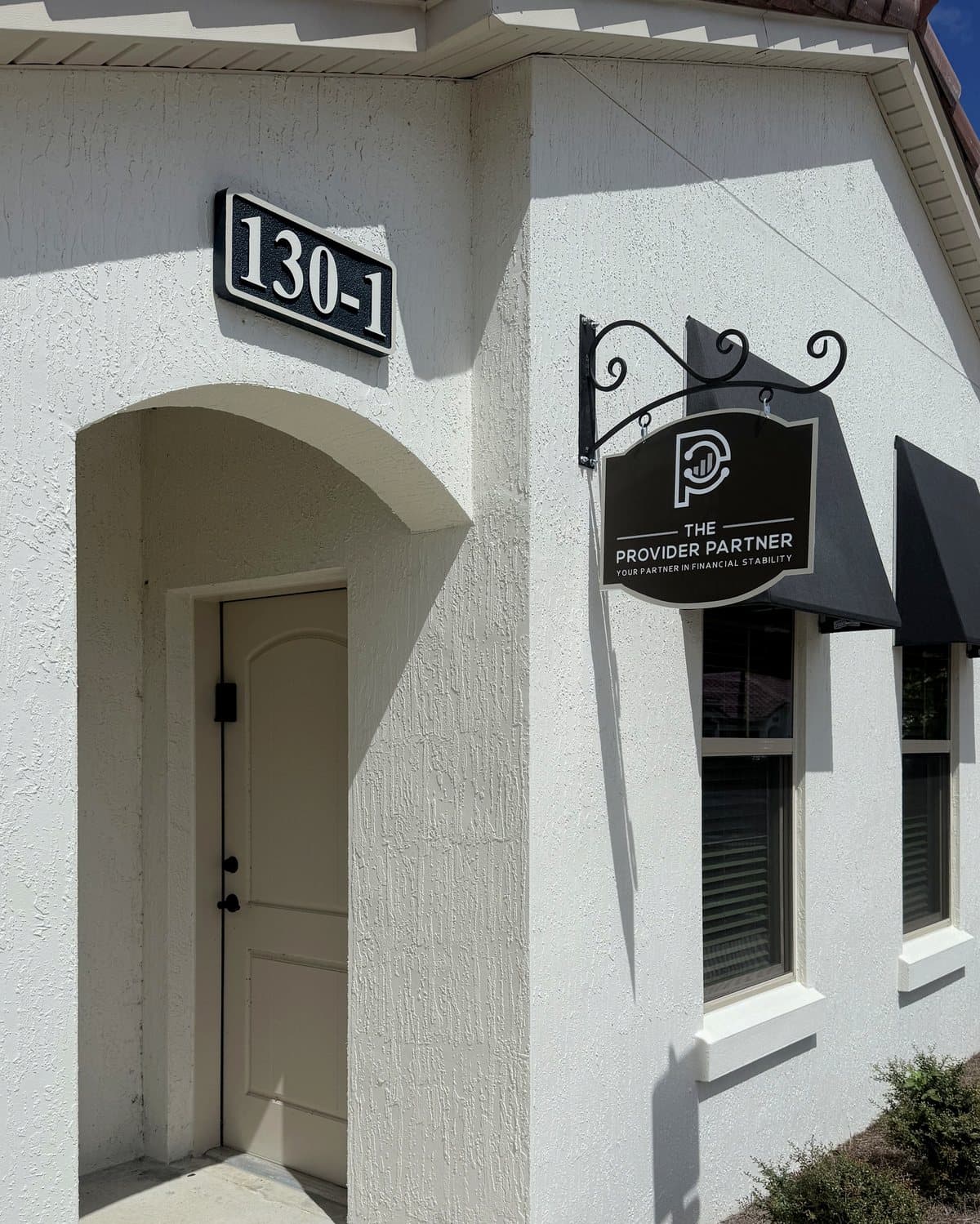 Entrance to The Provider Partner office, unit 130-1, with the hanging sign